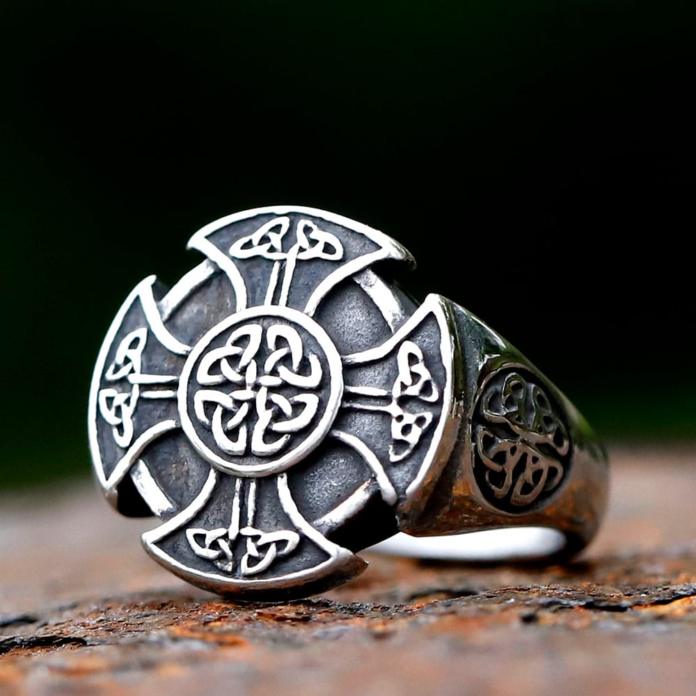 Side perspective displaying the solid construction and carved details of the ring