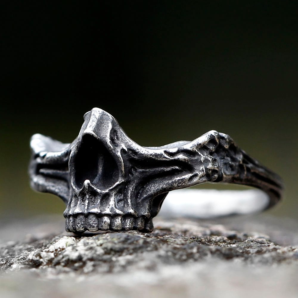 Detailed front view of the men's steel skull ring, showcasing intricate carvings.