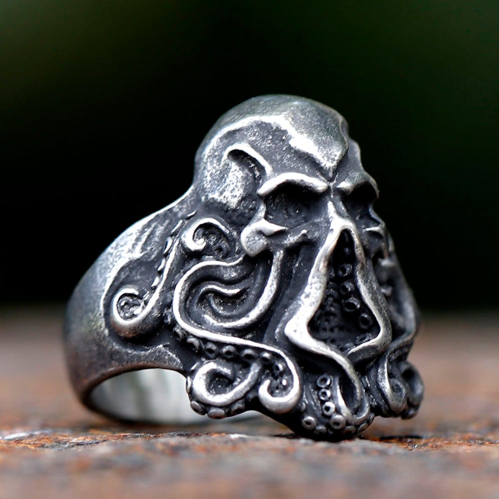 Close-up of the intricately designed octopus tentacles curving around the skull ring.