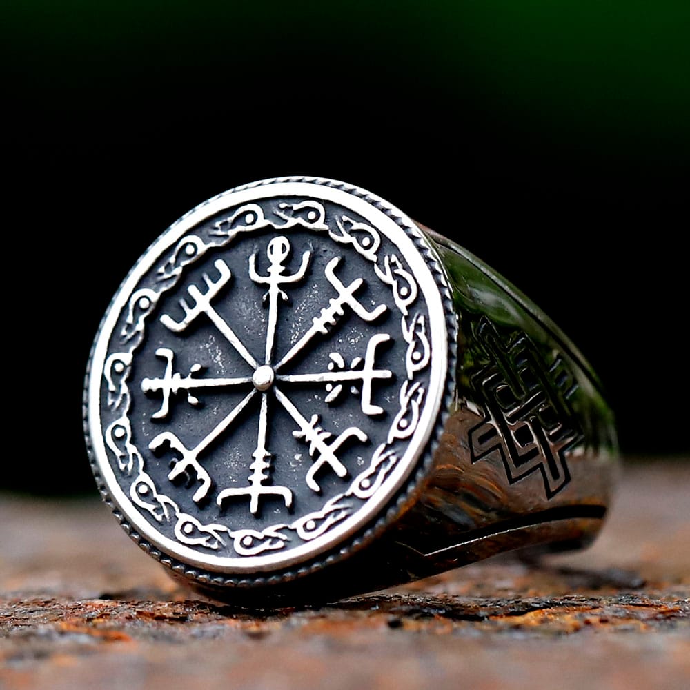 Men's 316L stainless steel Viking Vegvisir compass signet ring on a rustic surface