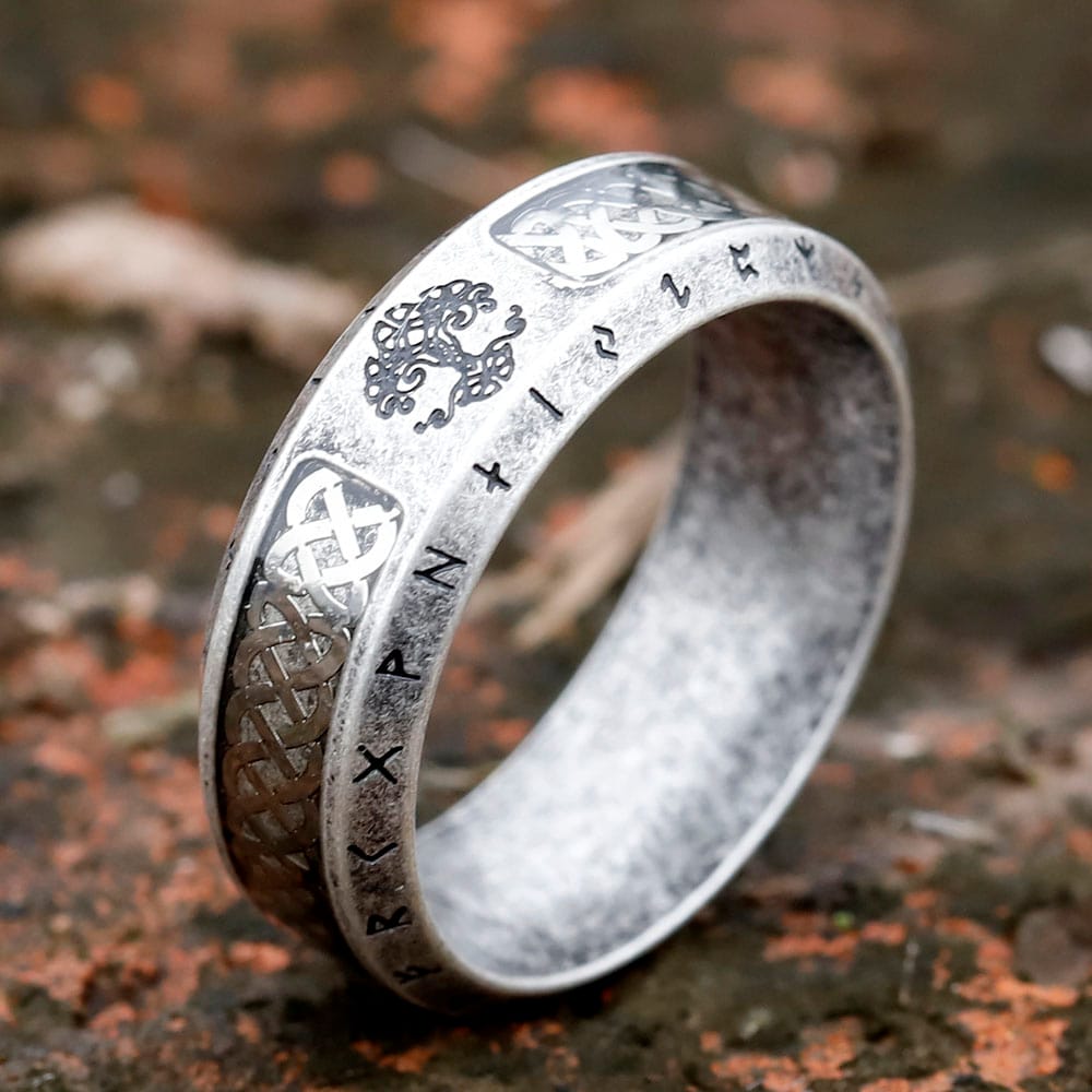 Full view of the weathered stainless steel Viking ring, showing Tree of Life, Celtic knots, and runes.