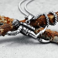 Close-up showing the scuba diver's fins and lower body on the pendant.