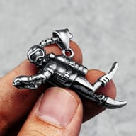 Detailed view of the scuba diver's helmet and oxygen tank on the pendant.
