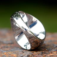 Side profile of the durable stainless steel ring, revealing the Square and Compasses Masonic symbol on the band.