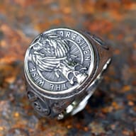 The robust 316L stainless steel Masonic ring displayed on a dark, textured surface, emphasizing its overall strong design.