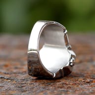 Close-up of the striking rectangular purple gemstone set in the vintage gothic stainless steel ring.