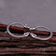 Angled shot showcasing the robust construction and polished finish of the snake earrings.