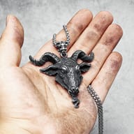 Close-up of the durable stainless steel chain and intricate bail connecting to the gothic ram pendant.