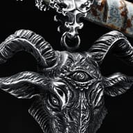 Front close-up of the ram goat pendant, highlighting the detailed snout, beard, and expressive features.