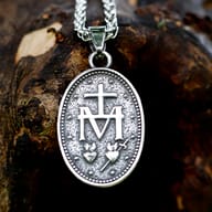 Angled shot of heavy duty Virgin Mary pendant on link chain