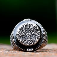 Top-down view of the intricate Tree of Life medallion on stainless steel signet ring