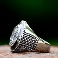 Detailed close-up of Celtic knot patterns on the side band of the Yggdrasil ring