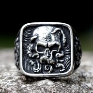 Side view detail of the 316L stainless steel punk rock ring, showing the band's intricate patterns.