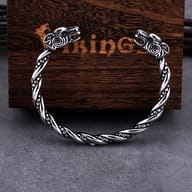 Full view of the open Viking goat head torc bracelet showing twisted band texture
