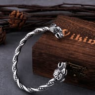 Viking goat head cuff bracelet worn on a man's wrist demonstrating fit and scale