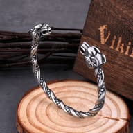 Stainless steel Viking goat head bracelet displayed with wooden storage box