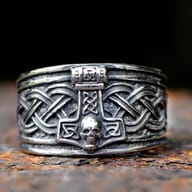 Close-up of Mjolnir and skull detail on stainless steel Norse ring