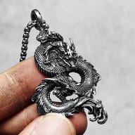 Textured body of the flying dragon pendant, showing robust detail