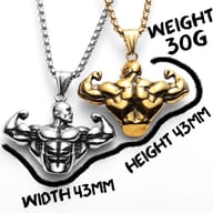 Bodybuilder pendant necklace displayed on a dark surface, showcasing its robust design and intricate details