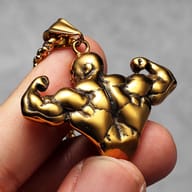 Side profile close-up of the bodybuilder pendant's arm and shoulder, demonstrating 316L steel finish