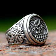 Side view of the Odin ship ring, showcasing the intricate band patterns.