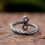 Textured twisted band of the 316L stainless steel Troll Cross ring.