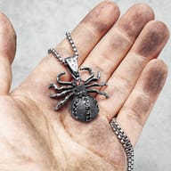 Detail of the pendant's ornate bail and chain link