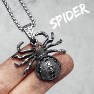 Full view of gothic spider pendant necklace on a finger with chain