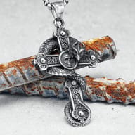 Detailed view of the gothic dragon skull cross pendant, highlighting the skull and dragon scales
