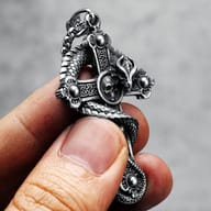 Side profile of the men's stainless steel dragon cross necklace pendant, emphasizing its unique design