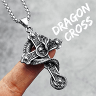 316L stainless steel dragon skull cross necklace pendant on a finger, showcasing full detail
