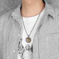 St. Christopher pendant necklace displayed on a dark background, highlighting its metallic sheen.