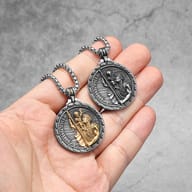 Close-up of the St. Christopher and Christ Child figures on the stainless steel medal.