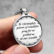 Reverse side of the St. Christopher medal pendant, showcasing its smooth polished stainless steel finish.