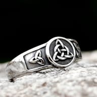 Overhead view of the Triquetra knot ring, highlighting its intricate design and solid construction.