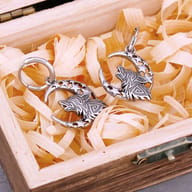 Front view of the Norse wolf and moon stainless steel drop earrings showing antique finish details