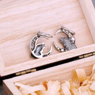 Side perspective of the wolf moon drop earring highlighting the secure hoop closure and thickness