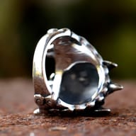 Side profile of the dragon ring, highlighting textured scales and horns.