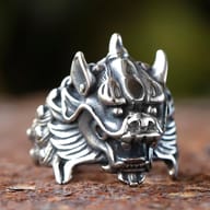 Detailed view of the dragon ring's scales and horn from the side.