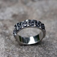 Angled view showcasing the durable 316L stainless steel construction of the skull ring.