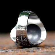 Inner band and smooth contoured interior of men's stainless steel alien ring