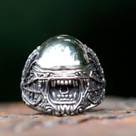 Front view of gothic alien skull ring in polished 316L stainless steel