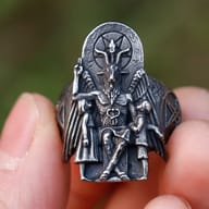 Close-up of the Baphomet figure on the signet ring, showing horns and pentagram detail.
