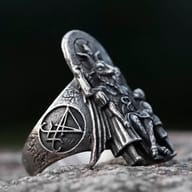 Side view of the Baphomet punk ring, showing the detailed relief and ring band.