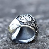 Top-down view of the elaborate Saint George motif on the stainless steel ring face
