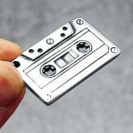 Top-down view of the durable stainless steel cassette pendant, showing texture