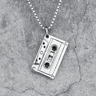 Stainless steel box chain attached to the cassette tape pendant against grey background