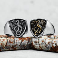 Macro detail of the dragon's head and scales on the shield surface of the 316L steel ring.
