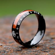 Detailed view highlighting the rich brown wood inlay sections on the men's ring.