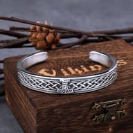 Side angle of the Viking hammer cuff bracelet highlighting the two-tone silver and gold finish